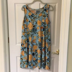 Sleeveless floral swing dress.